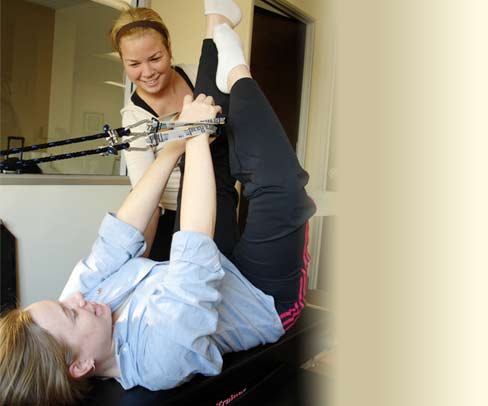 Client performing pilates exercise